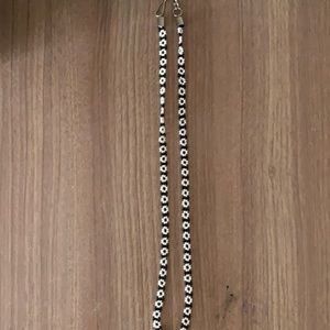 White and black flower necklace